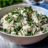 Fragrant rice pilaf with sweet spring peas and fresh mint, a light and flavorful accompaniment to ham or poultry.  